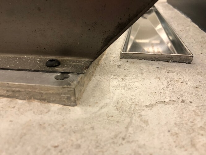 Edge of Table and Drain Concrete
